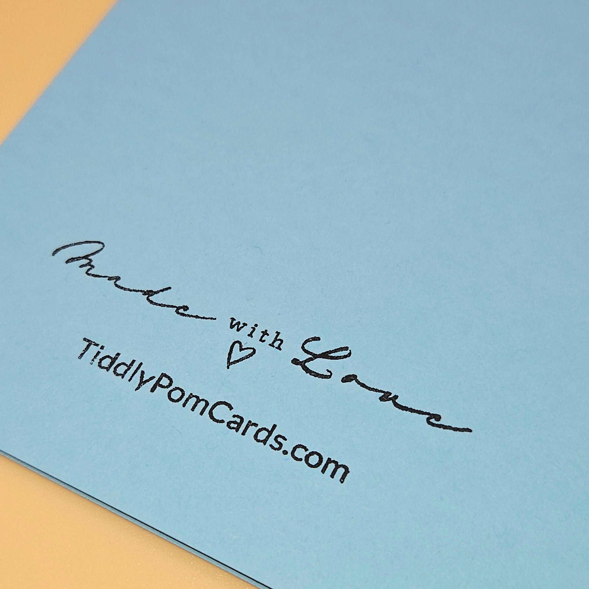 Blue card with 'Made with Love' text and TiddlyPomCards.com on a beige background