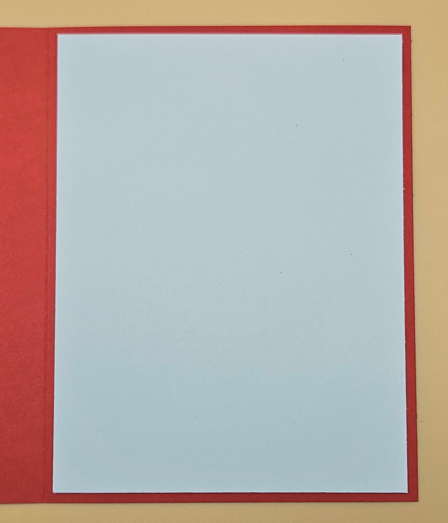 Rectangular frame with a red border on a beige background