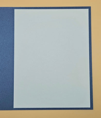 Plain white card with blue border on a beige background