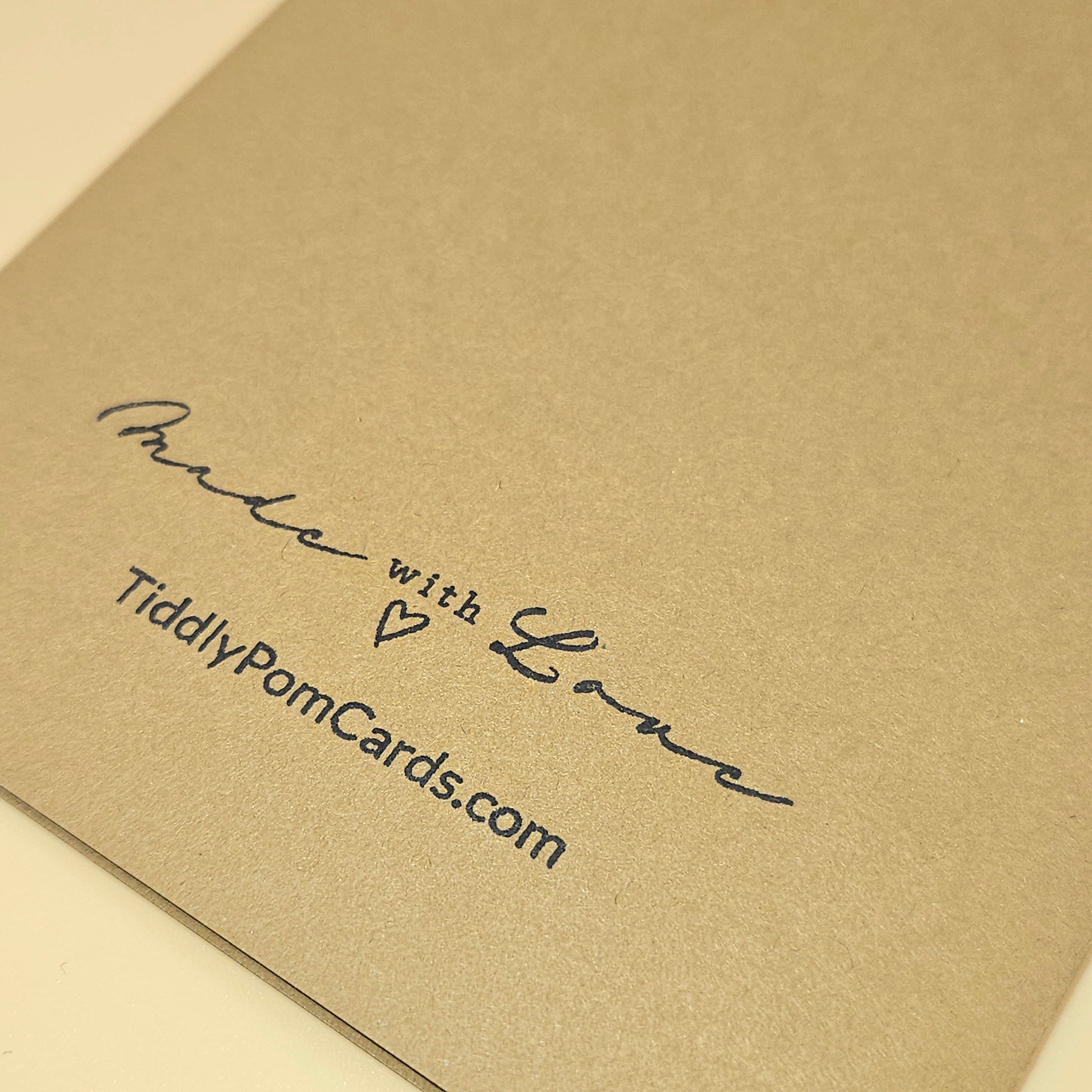Brown card with 'Made with Love' text and TiddlyPomCards.com on a beige background