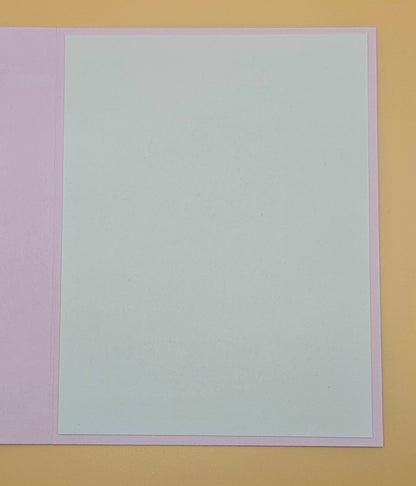 Solid light gray color swatch on a multicolored background