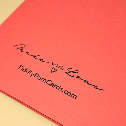 Red card with 'Made with Love' text and TiddlyPomCards.com on a beige background