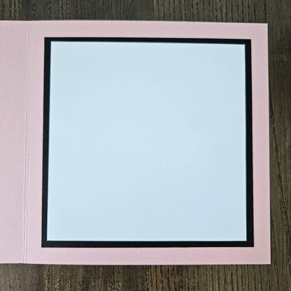 Handmade Winnie the Pooh Mother's Day card holding flowers on a pink border