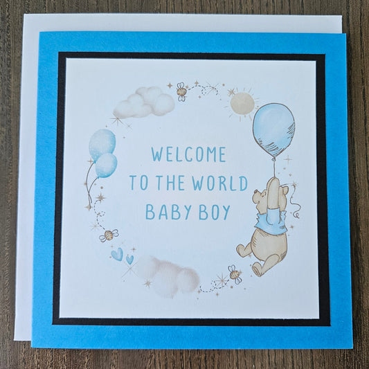 Baby shower card with Winnie the Pooh and balloons on a beige background