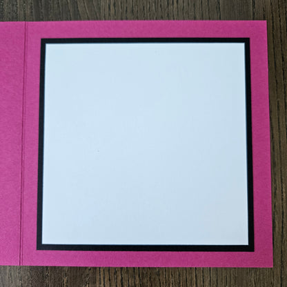 Pink border with a white center on a wooden surface