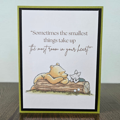Card with a bear and butterfly illustration and a quote on a white background