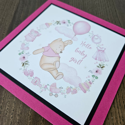 Baby shower card with Winnie the Pooh and balloons on a pink border