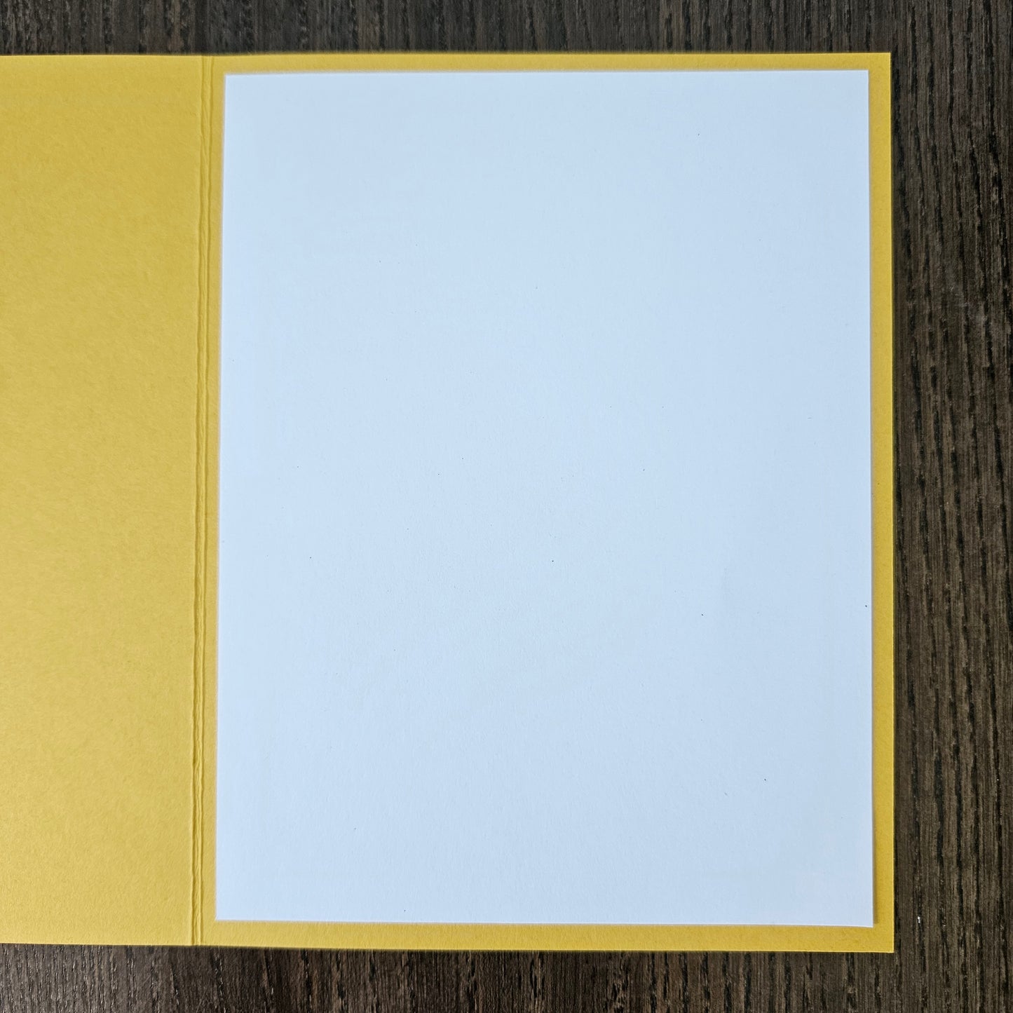 Card with Winnie the Pooh hugging a bear and a quote about love and hugs on a beige background.