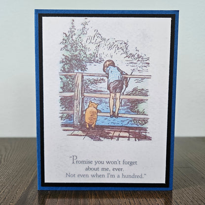 Card with illustration of a child and bear by a fence, with text 'Promise you won't forget about me, ever. Not even when I'm a hundred.