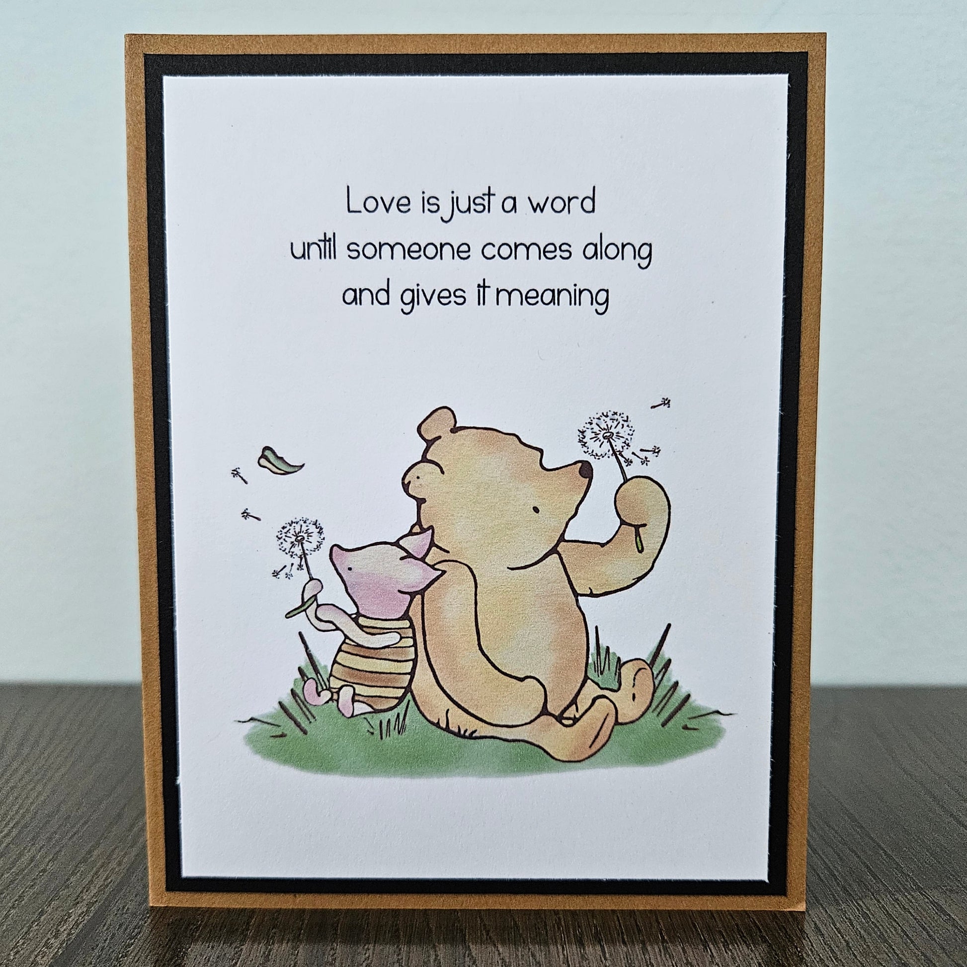 Handmade Winnie the Pooh love card featuring a gentle illustration of Pooh Bear and Piglet sharing a quiet afternoon surrounded by dandelions, finished with layered cardstock frames and a romantic front sentiment banner.