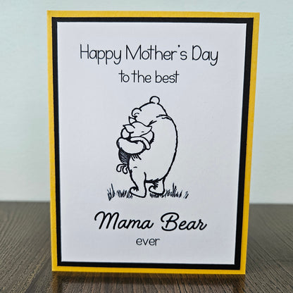 Winnie The Pooh Mother's Day card with text 'Happy Mother's Day to the best Mama Bear ever' on a beige background.