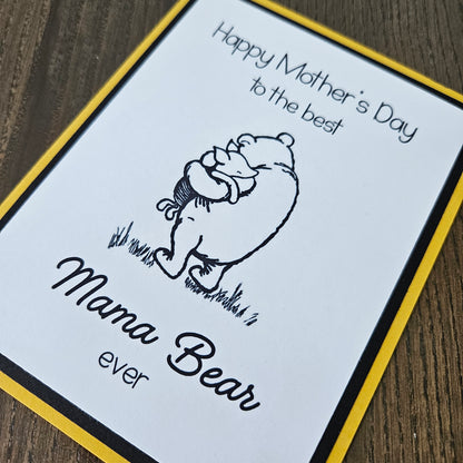 Winnie The Pooh Mother's Day card with text 'Happy Mother's Day to the best Mama Bear ever' on a beige background.