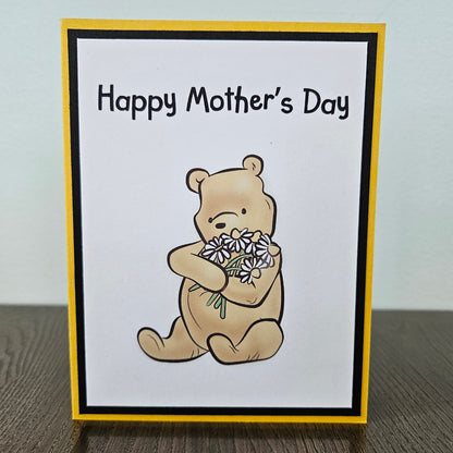 Mother's Day card with a bear holding flowers on a beige background