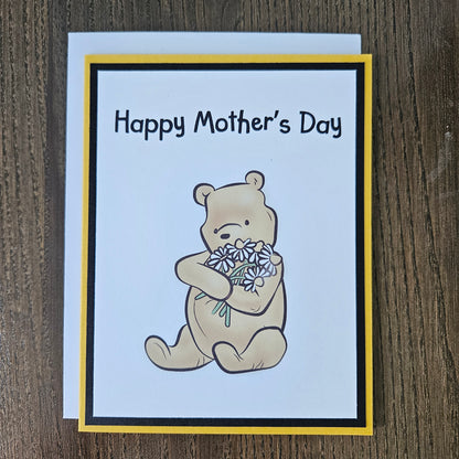 Mother's Day card with a bear holding flowers on a beige background