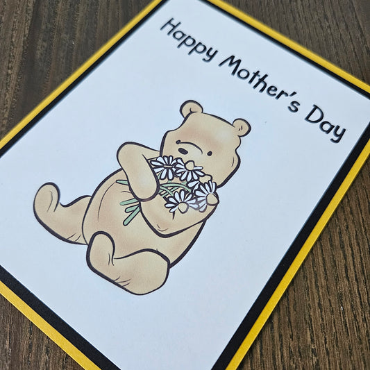 Mother's Day card with a bear holding flowers on a beige background