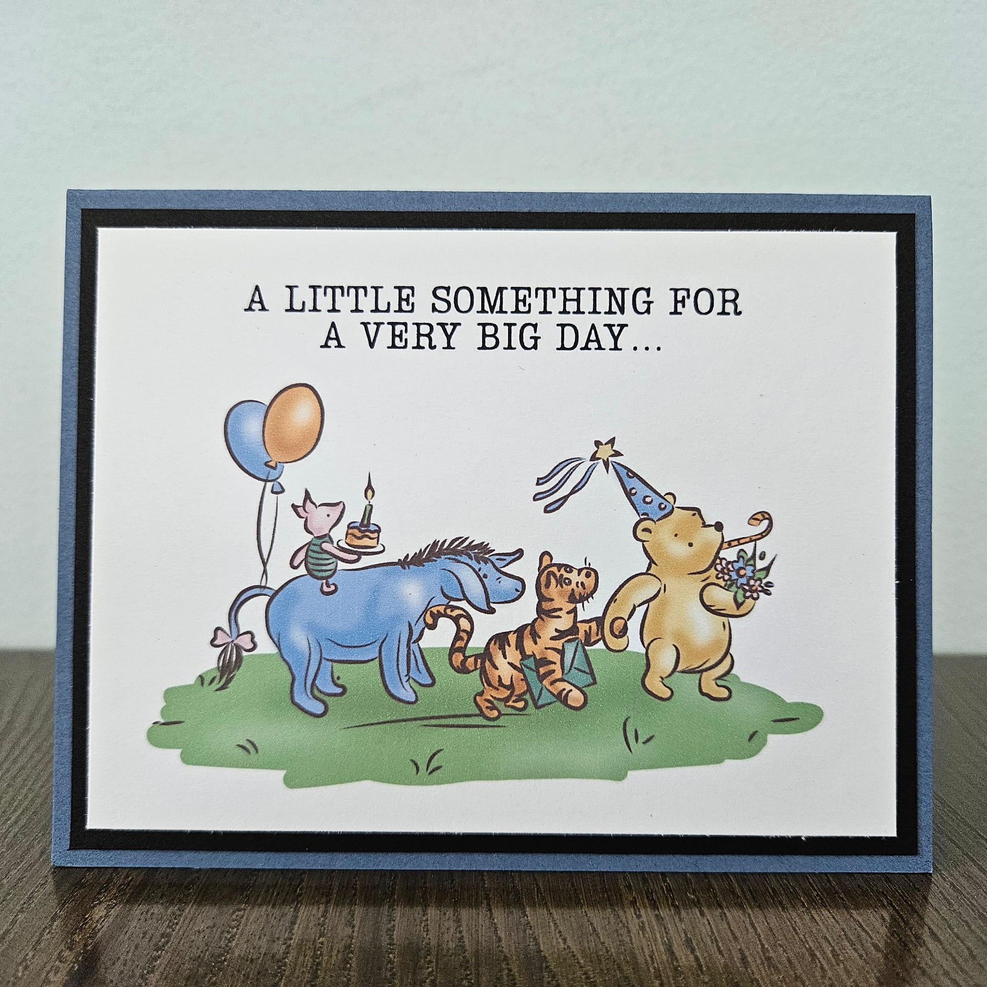 Greeting card with cartoon animals celebrating a birthday on a plain background