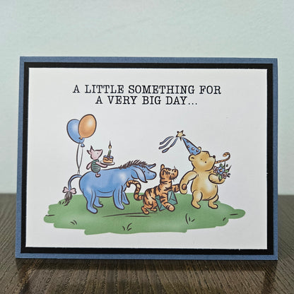 Greeting card with cartoon animals celebrating a birthday on a plain background
