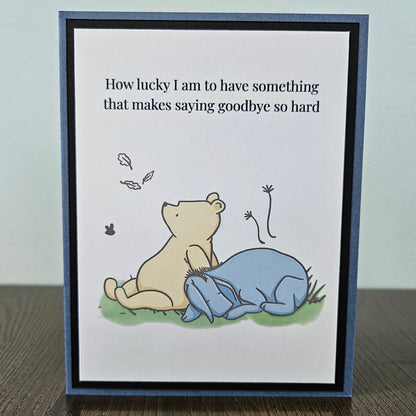 Handmade Winnie the Pooh goodbye card featuring an illustration of Pooh and Eeyore sitting together under falling autumn leaves next to the classic quote text banner.
