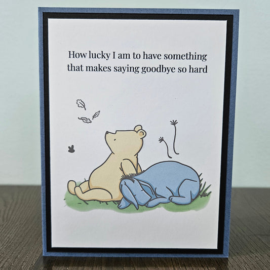 Handmade Winnie the Pooh goodbye card featuring an illustration of Pooh and Eeyore sitting together under falling autumn leaves next to the classic quote text banner.