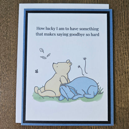 Handmade Winnie the Pooh goodbye card featuring an illustration of Pooh and Eeyore sitting together under falling autumn leaves next to the classic quote text banner.