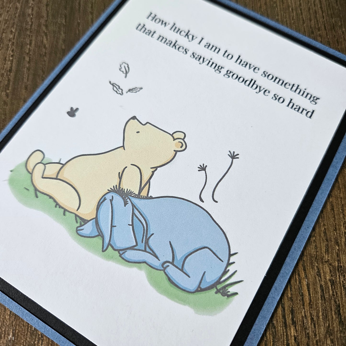 Handmade Winnie the Pooh goodbye card featuring an illustration of Pooh and Eeyore sitting together under falling autumn leaves next to the classic quote text banner.