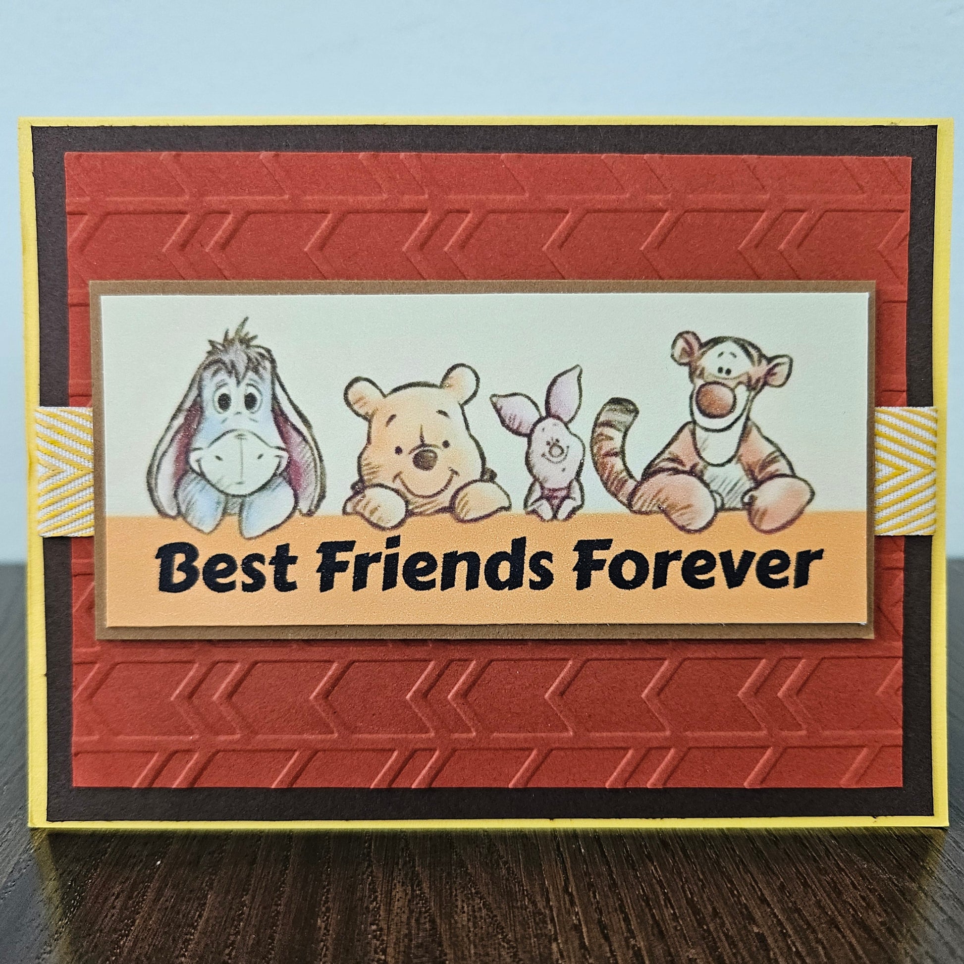 Card with cartoon characters and 'Best Friends Forever' text on a textured red background
