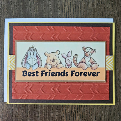 Card with cartoon bears and 'Best Friends Forever' text on a textured surface