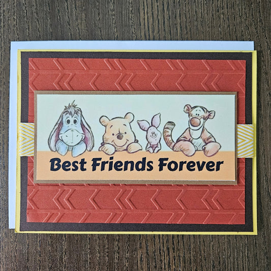 Card with cartoon bears and 'Best Friends Forever' text on a textured surface