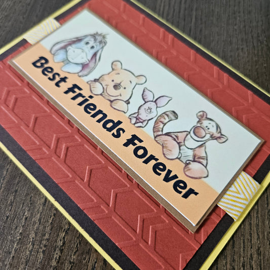 Card with cartoon bears and 'Best Friends Forever' text on a textured red background