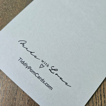 White card with 'Made with Love' and TiddlyPomCards.com text on a wooden surface