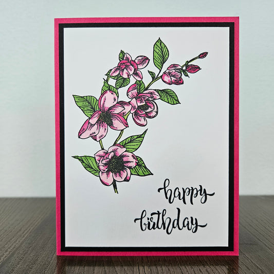 Handmade birthday card for her with hand-colored pink and magenta botanical floral branch on white inner panel with black and hot pink border. Text reads happy birthday.