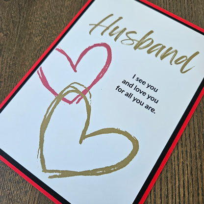 Greeting card for a husband with hearts and text on a wooden surface