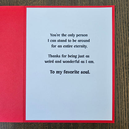 Greeting card with a message on a wooden surface