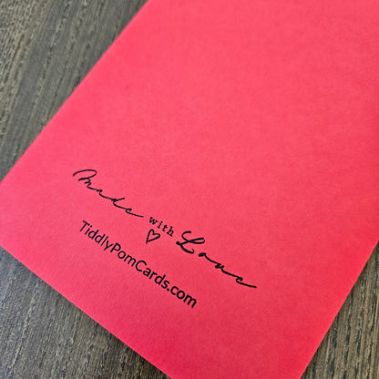 Red card with 'Made with Love' and TiddlyPomCards.com text on a wooden surface