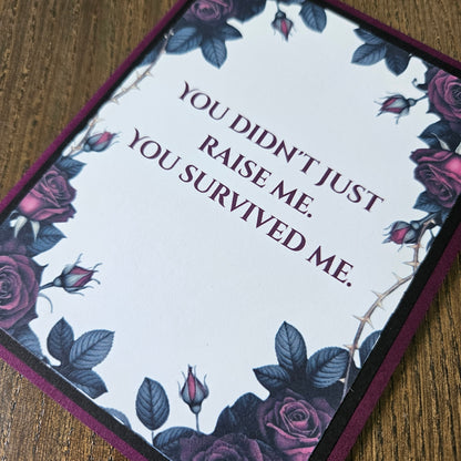 Card with floral design and text on a wooden surface