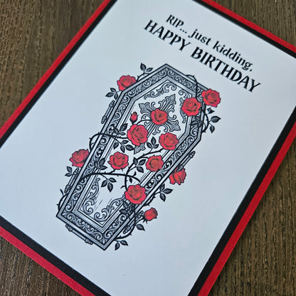 A square greeting card with a white face, red border, and black text reading 'Run.