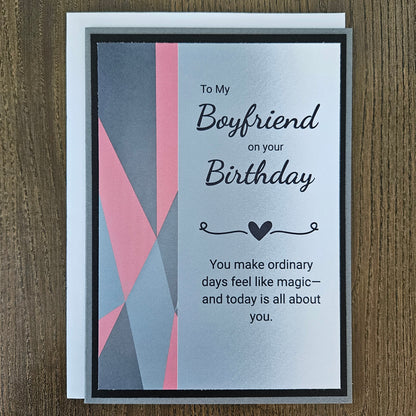 Front of a handmade A2 romantic birthday card for boyfriend featuring a bold red geometric heart with layered cardstock borders and text reading Happy Birthday to My Boyfriend.
