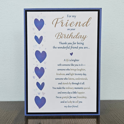 Front of a handmade 5x7 birthday card for friend featuring a vertical row of watercolor purple hearts framed in black and purple with a detailed birthday poem.