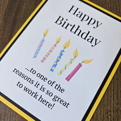 Front of a handmade A2 coworker birthday card featuring colorful birthday candles framed by black and yellow cardstock with text reading Happy Birthday to one of the reasons it is so great to work here.