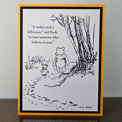 Front of a handmade A2 Winnie the Pooh friendship card featuring classic Pooh and Piglet walking together with the quote It makes such a difference to have someone who believes in you.