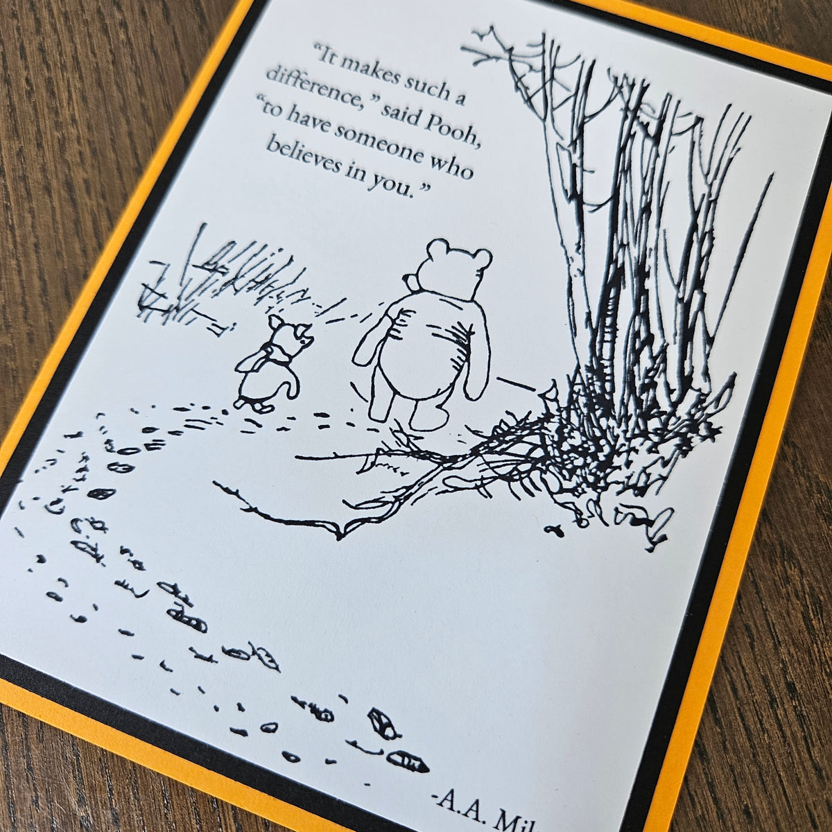 Front of a handmade A2 Winnie the Pooh friendship card featuring classic Pooh and Piglet walking together with the quote It makes such a difference to have someone who believes in you.
