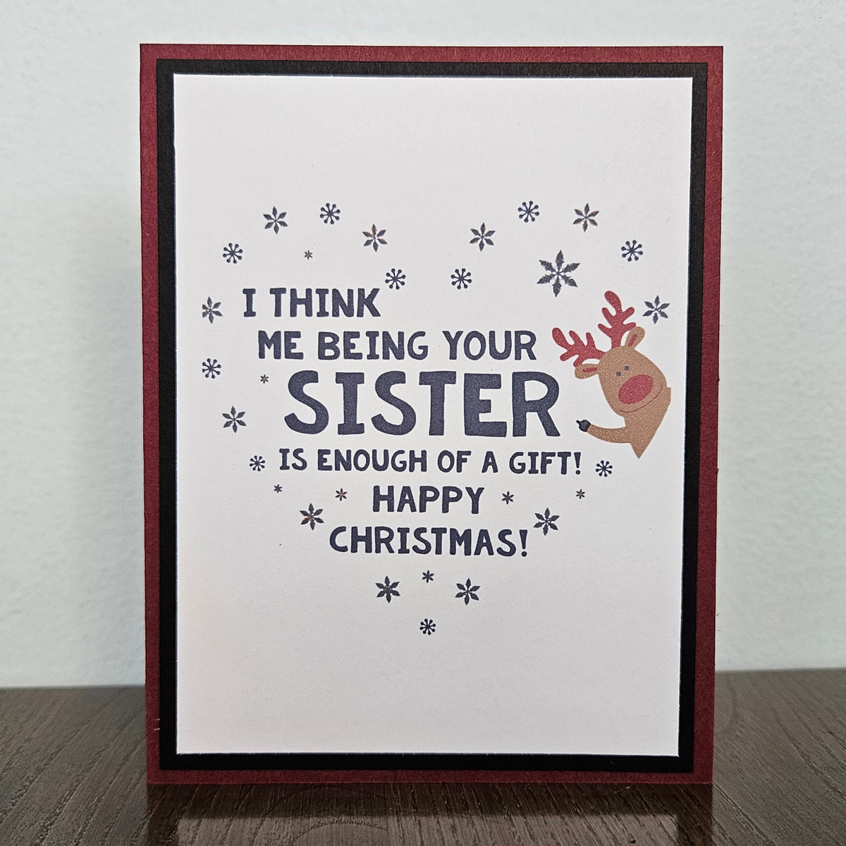 Handmade funny Christmas card for sister with enough of a gift message and cute red-nosed reindeer