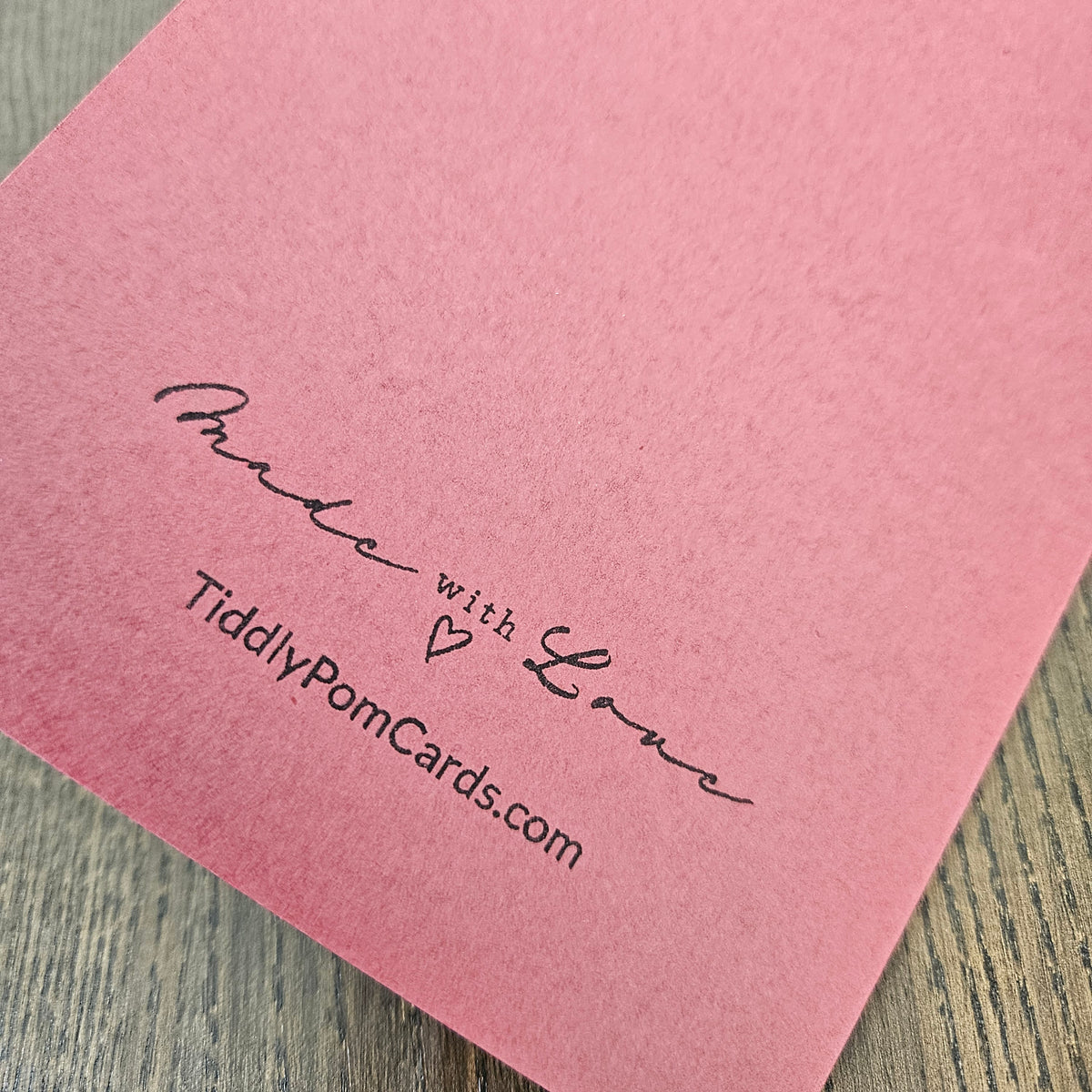 Burgundy handmade card back with Made with Love and TiddlyPomCards.com branding