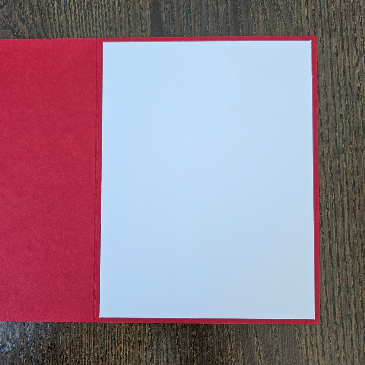 Blank white interior of red handmade A2 holiday bat greeting card 