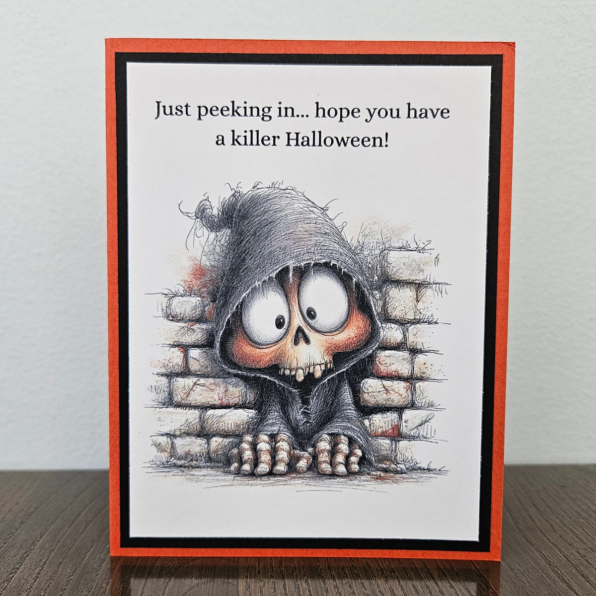 Handmade funny Halloween card with hooded peeking skeleton and killer Halloween sentiment