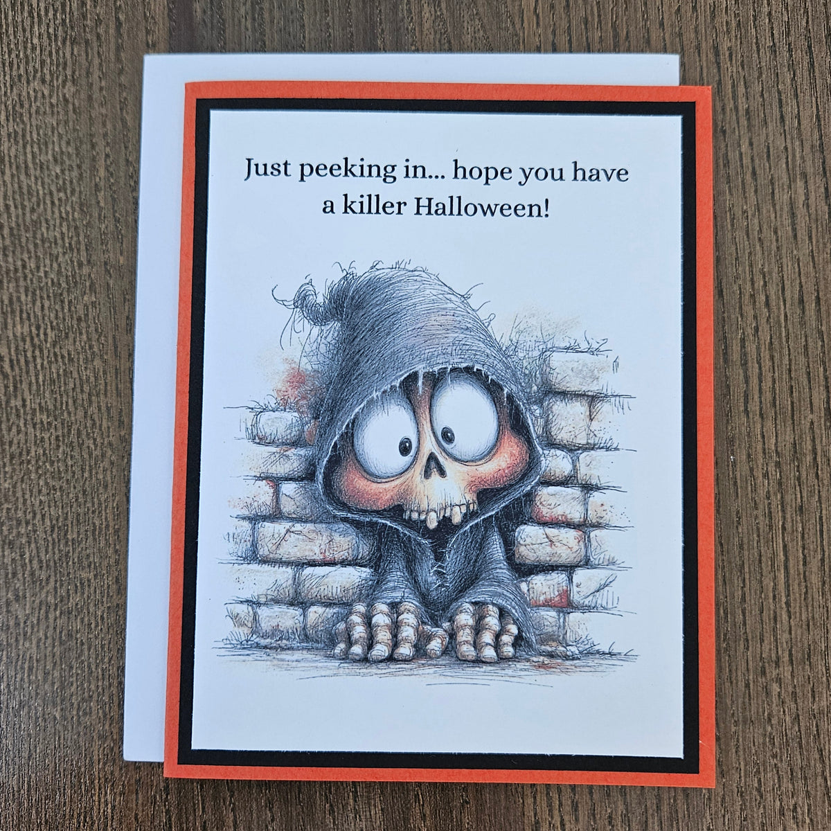 Handmade funny Halloween card with peeking grim reaper skeleton and killer sentiment