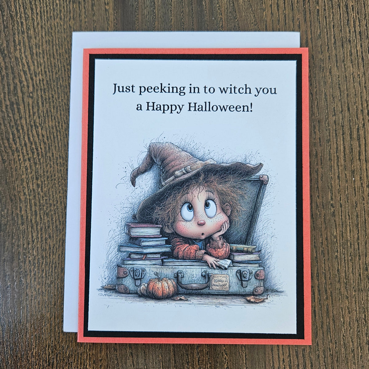Funny peeking witch Halloween card shown with its coordinating white envelope