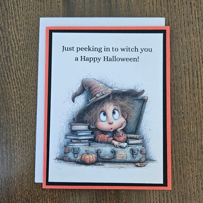Funny peeking witch Halloween card shown with its coordinating white envelope