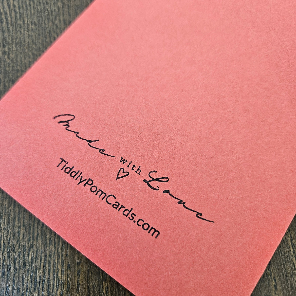 Coral handmade card back with Made with Love and TiddlyPomCards.com branding