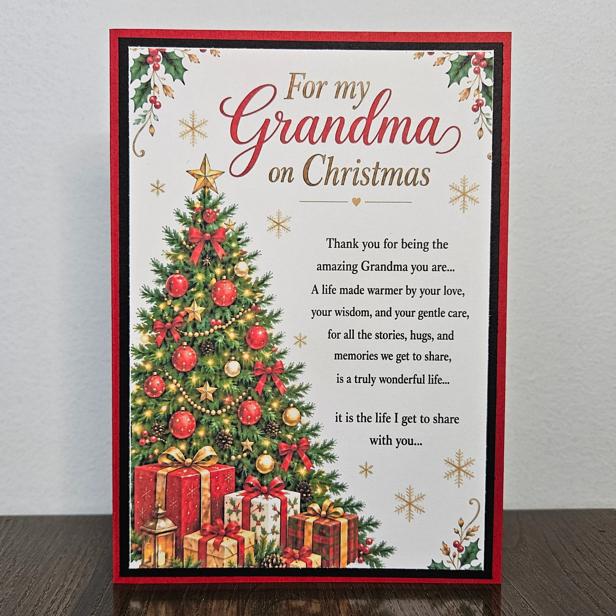 Handmade Grandma Christmas card with a decorated tree, gifts and a printed poem on a white card front.
